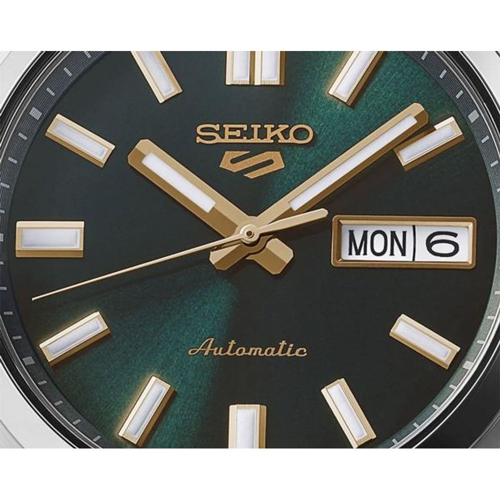Seiko_o 5 Sports SNXS Automatic silver  green and yellow niddle